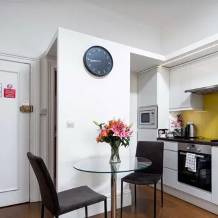 Rent this 4 bed townhouse on The Apartments in 41 Draycott Place, London