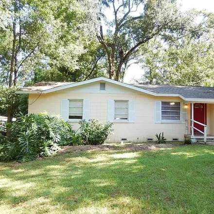 Rent this 4 bed house on 2460 Surrey Street in Tallahassee, FL 32304