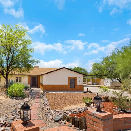 Buy this 3 bed house on 1433 West Placita Pingo in Casas Adobes, AZ 85704
