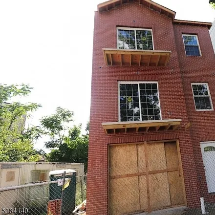 Buy this 6 bed townhouse on 89 Winans Avenue in Newark, NJ 07108