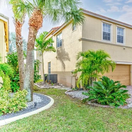 Buy this 4 bed house on 9850 Woolworth Court in Wellington, FL 33414