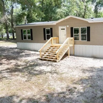 Buy this studio apartment on 244 Southwest Walnut Place in Columbia County, FL 32038