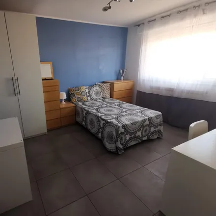 Rent this 6 bed room on Via Fabio Numerio in 14, 00181 Rome RM