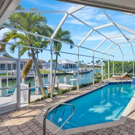 Buy this 3 bed house on 284 Windbrook Court in Marco Island, FL 34145