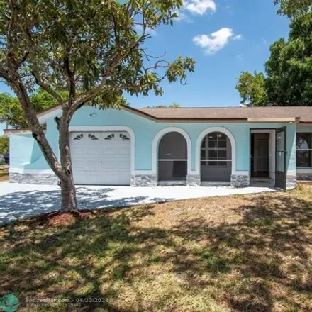 Buy this 3 bed house on 49 Crestwood Circle East in Lehigh Acres, FL 33936
