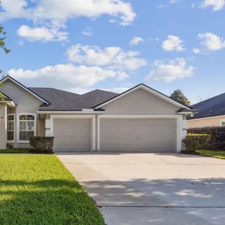 Buy this 4 bed house on 1310 Loch Tanna Loop in Fruit Cove, FL 32259