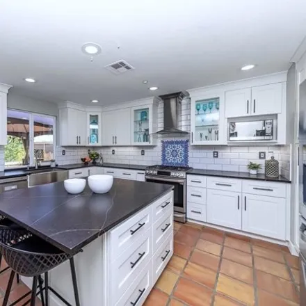 Buy this 4 bed house on 1733 Creekside Lane in Vista, CA 92056