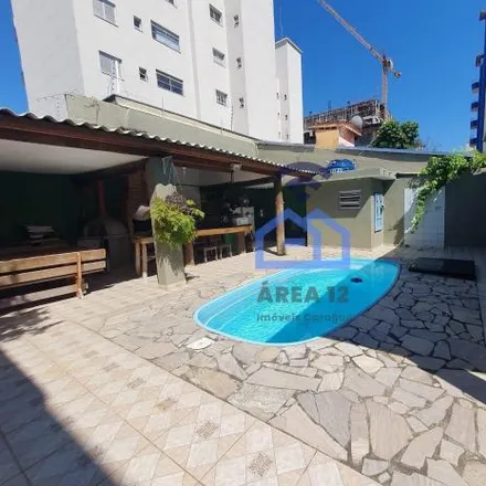 Rent this 4 bed house on Rua Luiz Lyria Martinez in Jardim Bela Vista, Caraguatatuba - SP