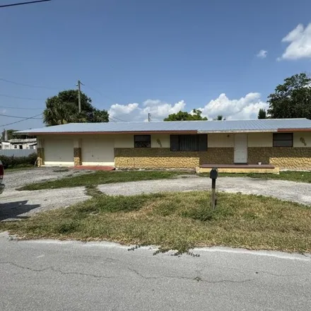 Buy this 3 bed house on 678 Northwest 7th Street in Belle Glade, FL 33430