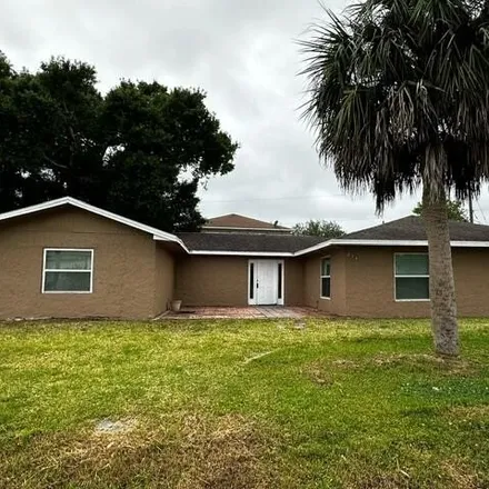 Rent this 3 bed house on 403 Newgate Street Northwest in Palm Bay, FL 32907