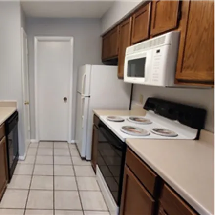 Rent this 2 bed townhouse on 8705 Schick Road in Austin, TX 78729