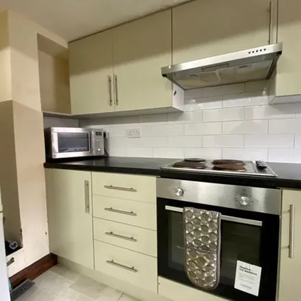 Rent this 4 bed townhouse on Royal Park Avenue in Leeds, LS6 1EZ