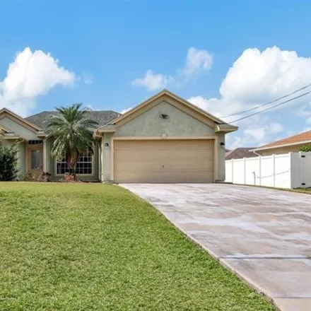 Buy this 3 bed house on 1890 Southwest Inlander Avenue in Port Saint Lucie, FL 34953