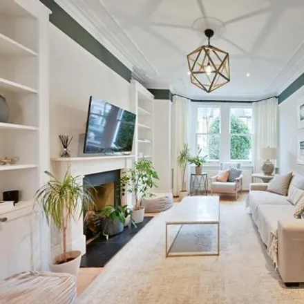 Image 1 - 28 Southdean Gardens, London, SW19 6NU, United Kingdom - Townhouse for rent