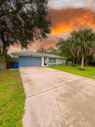 Buy this 4 bed house on 1401 Salerno Avenue Southeast in Palm Bay, FL 32909