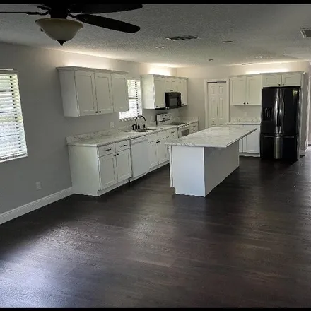 Rent this 3 bed house on 1568 24th Avenue in Vero Beach, FL 32960