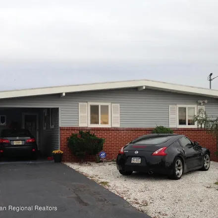 Buy this 3 bed house on 73 East Pampano Drive in Brick Township, NJ 08723