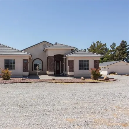 Buy this 4 bed house on 1001 Pluto Street in Pahrump, NV 89048