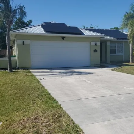 Buy this 3 bed house on 1911 Southeast Gaskins Circle in Port Saint Lucie, FL 34952