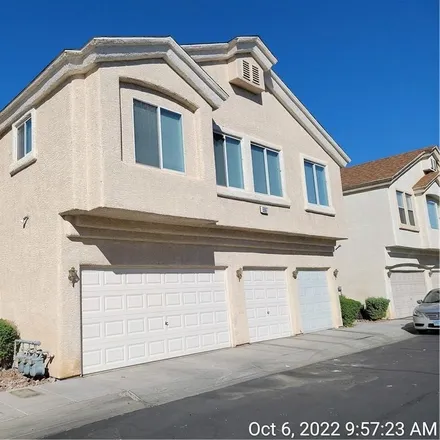 Rent this 3 bed townhouse on 5975 Trickling Descent Street in Clark County, NV 89011