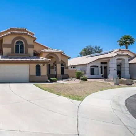 Buy this 4 bed house on 13879 West Cambridge Avenue in Goodyear, AZ 85395