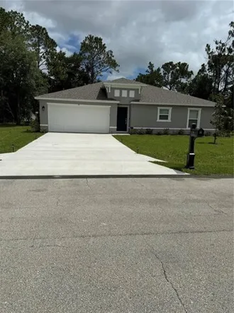 Rent this 3 bed house on 71 Pinwheel Lane in Palm Coast, FL 32164