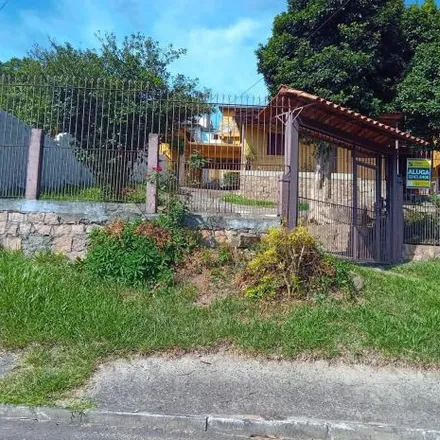 Rent this 3 bed house on Rua Deus de Cardoso in Vila Nova, Porto Alegre - RS