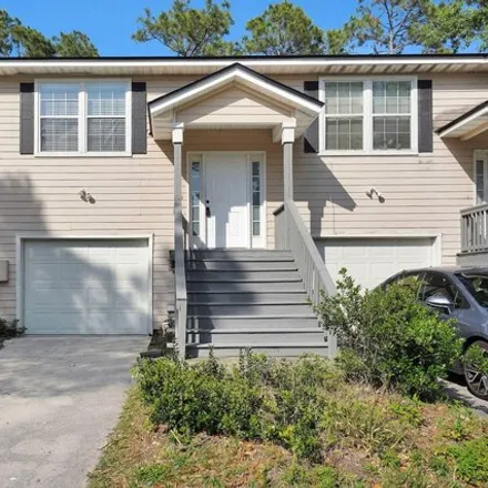 Rent this 3 bed house on 8386 Caravelle Drive in Oak Hill Park, Jacksonville