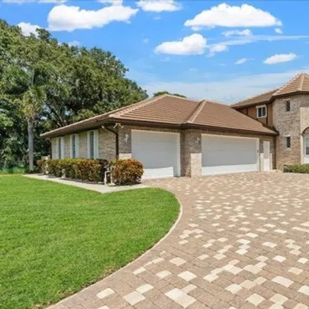 Buy this 5 bed house on 9090 South Tropical Trail in Brevard County, FL 32952