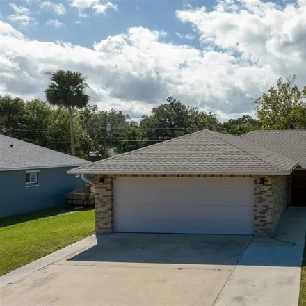 Buy this 4 bed house on 3210 Kumquat Drive in Edgewater, FL 32141