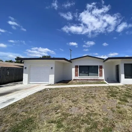 Rent this 4 bed house on 1314 West 3rd Street in Riviera Beach, FL 33404