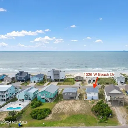 Buy this 2 bed house on 1026 W Beach Dr in Oak Island, North Carolina