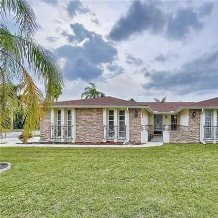 Buy this 3 bed house on 6001 Seabreeze Drive in Jasmine Estates, FL 34668