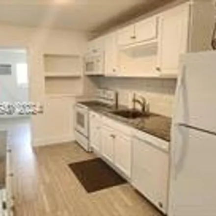 Rent this 3 bed house on 421 East Commercial Boulevard