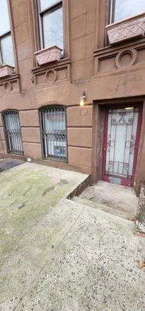 Rent this studio townhouse on 318 East 120th Street in New York, NY 10035