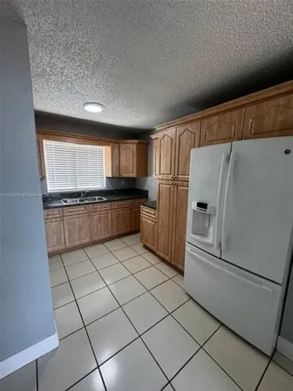 Rent this 3 bed townhouse on 2745 West 61st Place in Hialeah, FL 33016