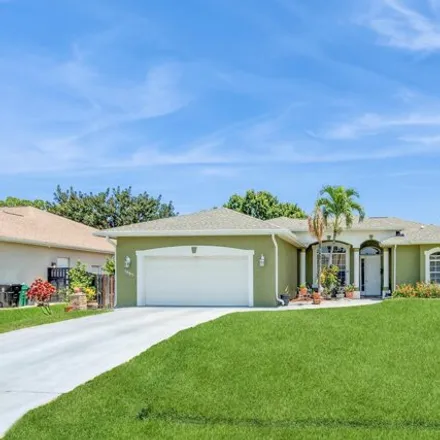 Buy this 4 bed house on 1885 SW Altman Ave in Port Saint Lucie, Florida