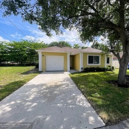 Buy this 3 bed house on 3012 Northwest 9th Street in Washington Park, Broward County