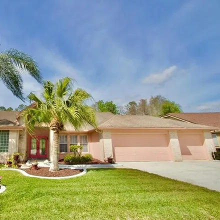 Buy this 4 bed house on 1449 Hoversham Drive in Trinity, FL 34655