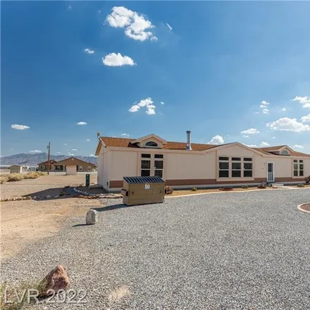 Buy this 4 bed house on 4941 West Basin Avenue in Pahrump, NV 89060