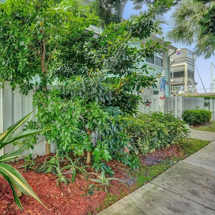 Rent this 2 bed townhouse on 2700 Northeast 15th Court in Country Club Isles, Pompano Beach