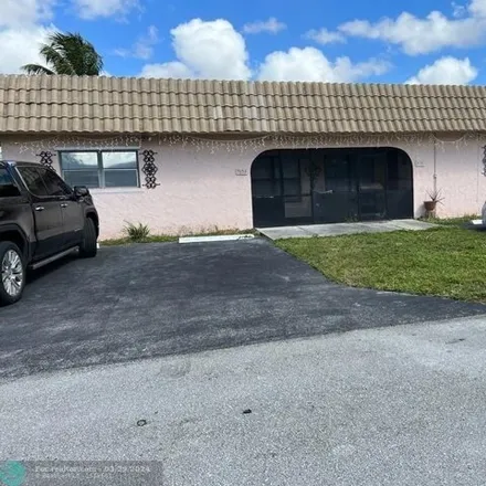 Rent this 4 bed house on 7821 Northwest 70th Court in Tamarac, FL 33321