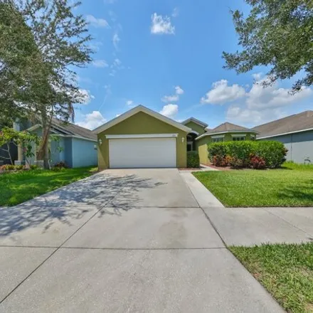 Buy this 4 bed house on 8116 Alamosa Wood Ave in Ruskin, Florida