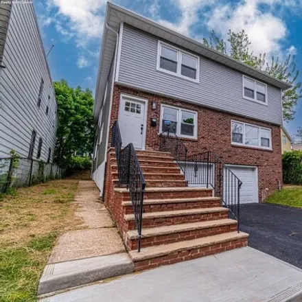 Buy this 7 bed house on 113 Smith Street in Newark, NJ 07106