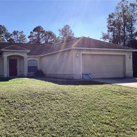 Rent this 3 bed house on 2651 19th Street West in Lehigh Acres, FL 33971