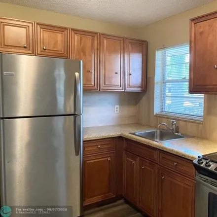 Rent this 2 bed condo on Dunkin' in 751 East Commercial Boulevard, North Andrews Gardens