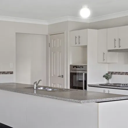 Rent this 4 bed apartment on Caspian Court in Wulkuraka QLD 4305, Australia