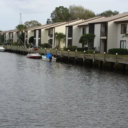 Rent this 2 bed condo on 379 Moorings Cove Drive in Tarpon Springs, FL 34689