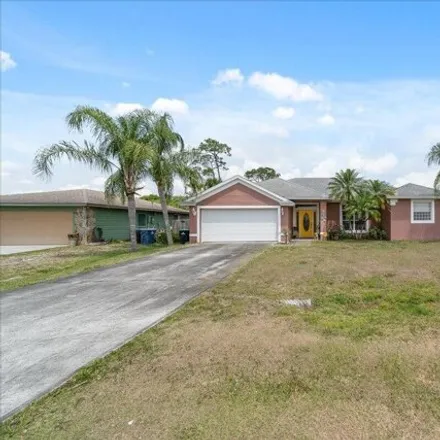 Buy this 3 bed house on 671 Americana Blvd Nw in Palm Bay, Florida