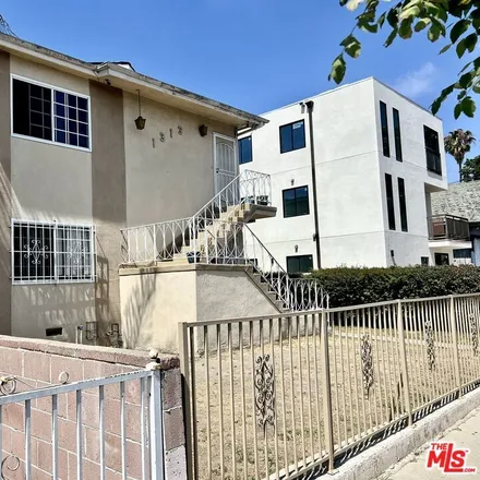 Buy this studio townhouse on 3799 South Gramercy Place in Los Angeles, CA 90062